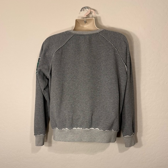 NWOT UNIVERSAL STUDIOS HARRY POTTER WORLD SLYTHERIN SWEATSHIRT IN SIZE LARGE - Picture 2 of 5